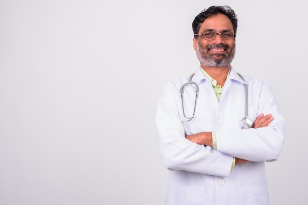 mature handsome bearded Indian man doctor on white