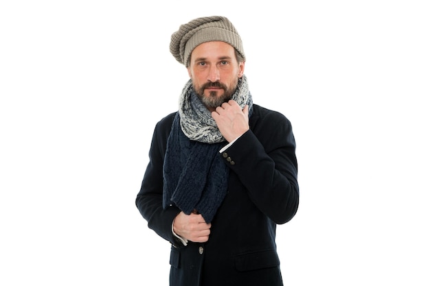 Mature man feeling cold in winter. chill outside. winter weather forecast. man wear warm clothes. bearded man in knitted hat and scarf. winter fashion accessory. male isolated on white.