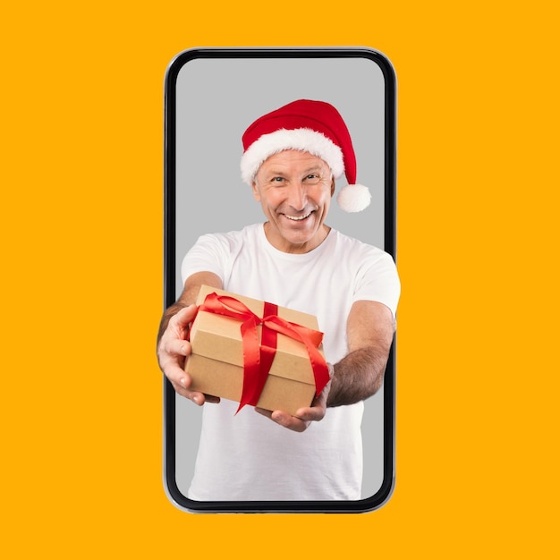 Mature Man Giving Christmas Present Coming Out Cell Screen