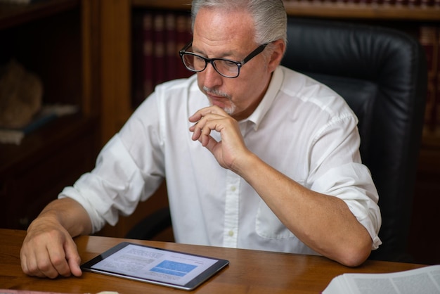 Mature man using tablet