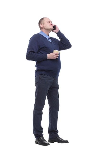 Mature man with a smartphone and a takeaway coffee