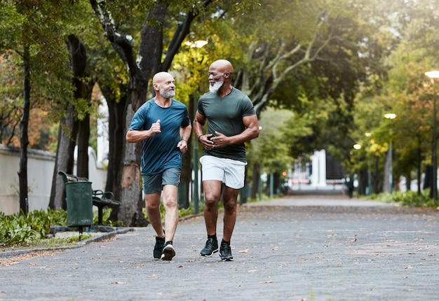 Mature men and fitness with friends running in park for exercise workout and wellness Exercising working out and diverse male athletic friend in cardio training for body health and stamina