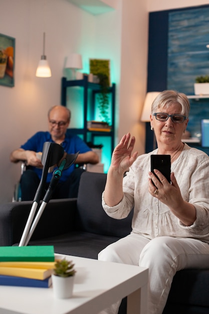 Mature retired couple on modern video call at home