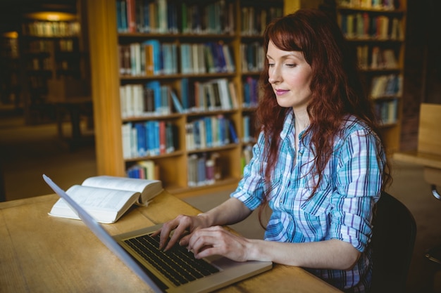 Mature student studying in library