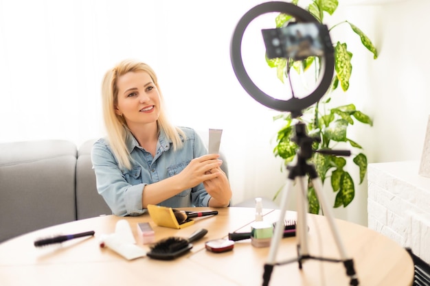 Mature woman beauty blogger, records makeup video for senior women.