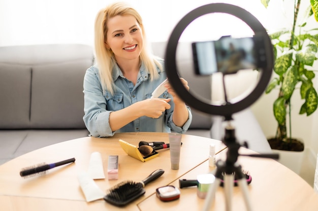 Mature woman beauty blogger, records makeup video for senior women.