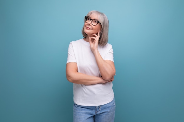 Mature woman in gray hair being premenopausal in studio background