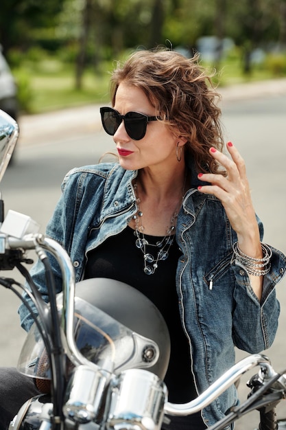 Mature Woman Sitting on Motorcycle