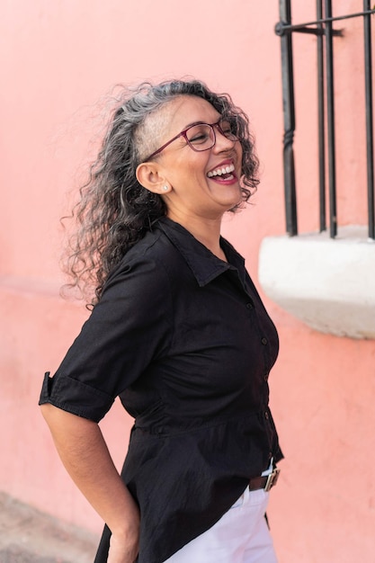 Mature woman smiling in the city