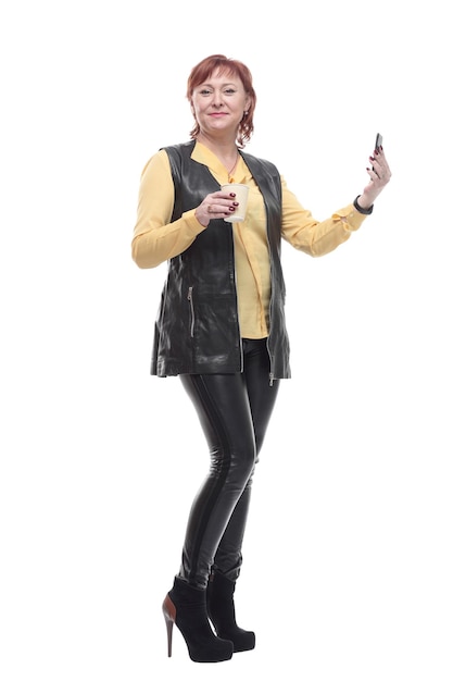 Mature woman with smartphone and coffee to take away