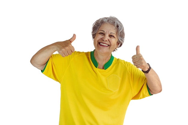 Mature Woman with Soccer Team Yellow Shirt Isolated on White