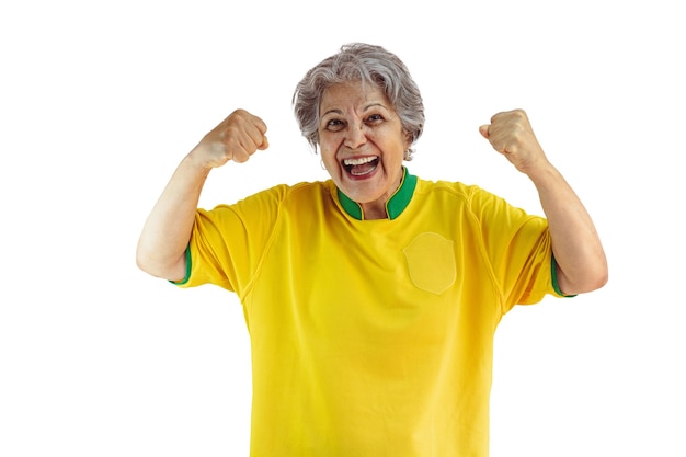 Mature Woman with Soccer Team Yellow Shirt Isolated on White