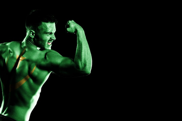 Mauritania flag on handsome young muscular man black background