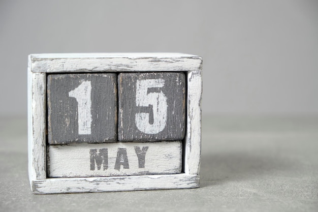 May 15 calendar made wooden cubes gray backgroundWith an empty space for your textFamily and Climate Day