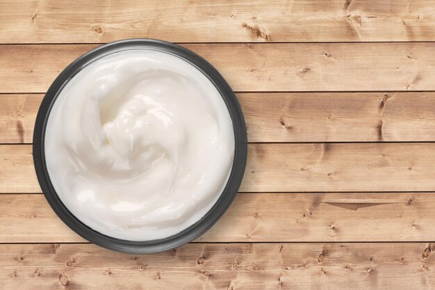 Mayonnaise souse swirl in a bowl on the desk.