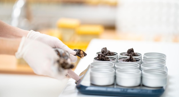 Measuring cups for natural organic cosmetics in the factory