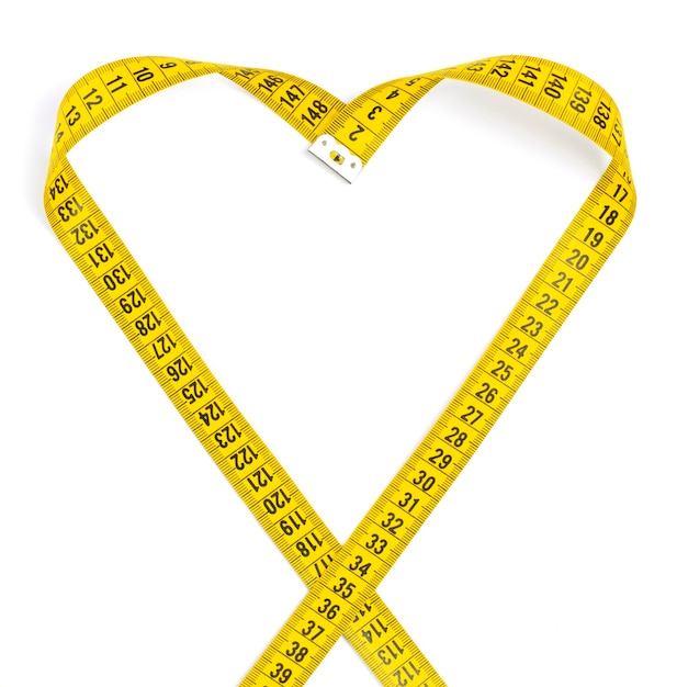 Measuring tape makes heart, isolated on white