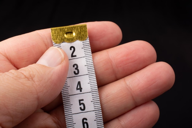 Measuring tape for tool roulette or ruler in hand