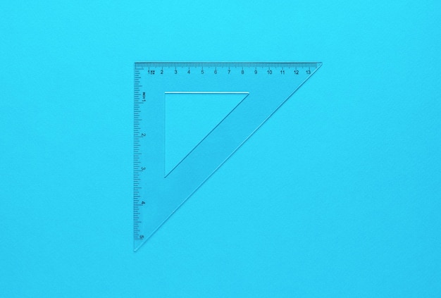 Measuring transparent triangle on a light blue background