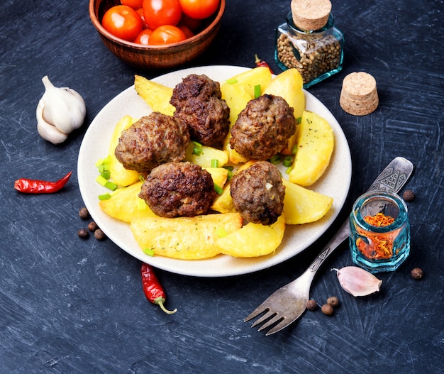 Photo meat balls with baked potatoes