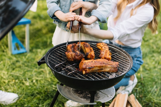 Meat on barbecue grill in nature