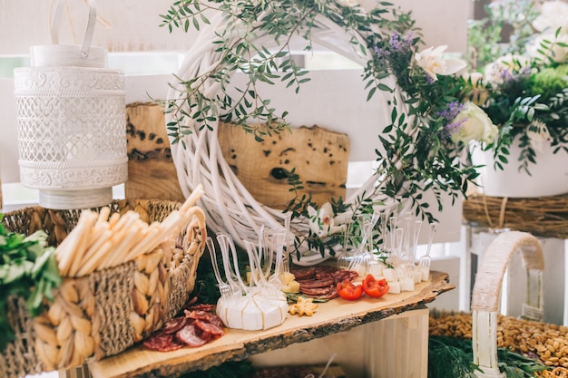 Meat, cheese and nutmeg wedding buffet with various snacks.