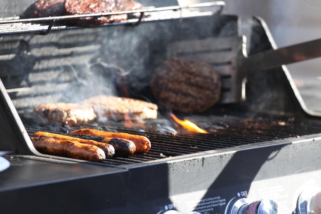 Meat cooking on barbecue grill