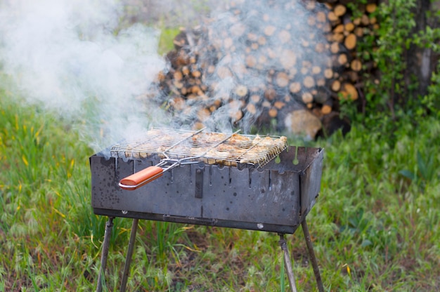 Meat is fried on a grid on the grill