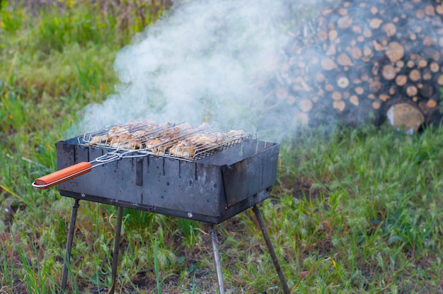 Meat is fried on a grid on the grill