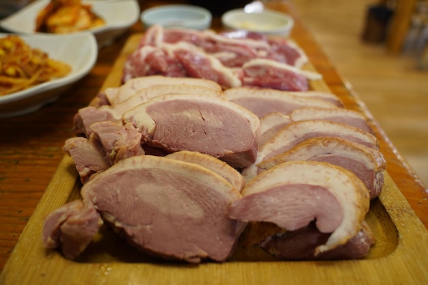 meat is on a table with other foods including meat and meat