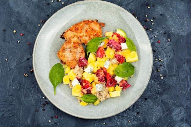 Meat salad with citrus fruits cheese and quinoa