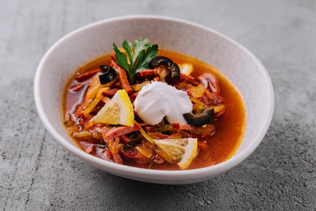 meat and salt soup Solyanka in bowl