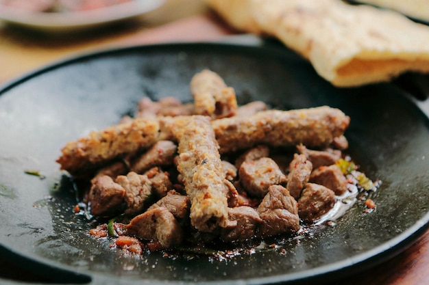 Meat saute in traditional pan Sac kavurma Turkish Food