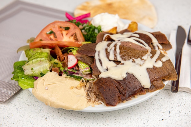 Meat Shawarma Doner on a plate Meat Shawarma plate isolated on white background