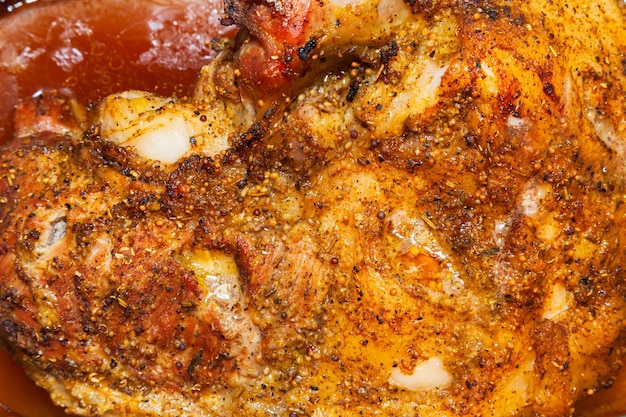 Meat in spices baked in a glass form in its own juice closeup