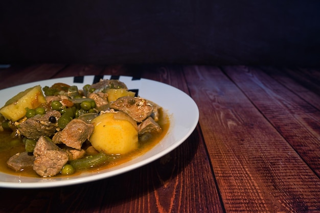 Meat stew on your plate on a wooden background world food day concept