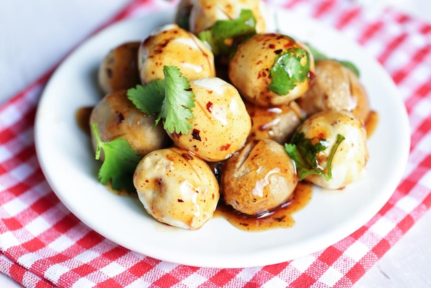 Meatballs on plate with with spicy sauce Grilled meatball and pork ball Meat ball and fresh coriander vegetables cabbage Thai food Asian food Meat balls pork balls