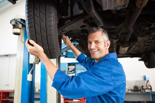 Mechanic adjusting the tire wheel