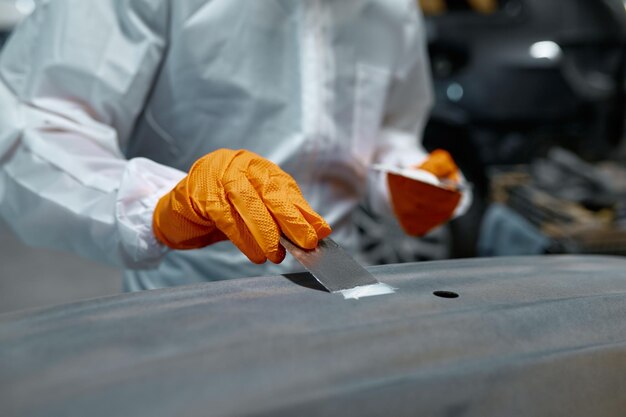 Mechanic engaged in local repairing car body