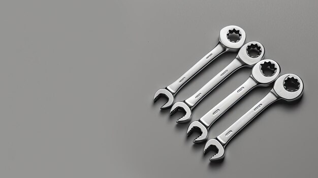 Photo mechanic essentials chrome spanner keys arranged side by side in a minimal flat lay with copy space