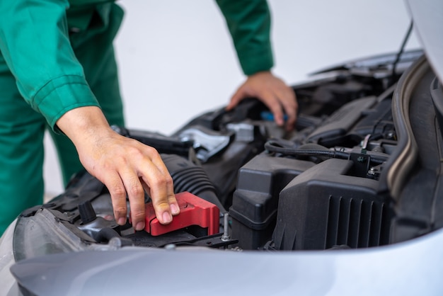 Mechanic man is fixing the engine