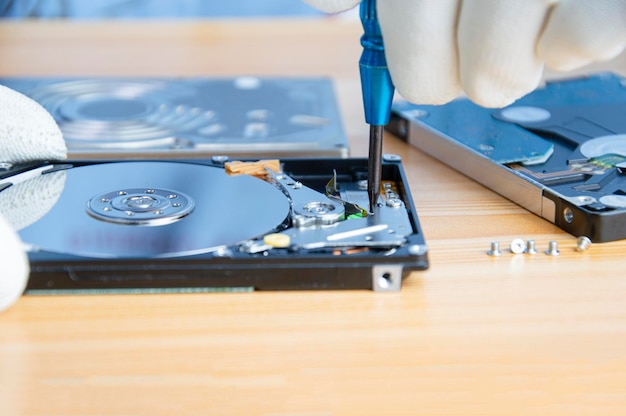 Mechanic repairing hard drive hard drive It is a device for storing data