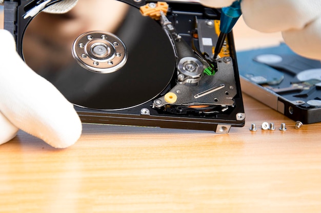 Mechanic repairing hard drive hard drive It is a device for storing data