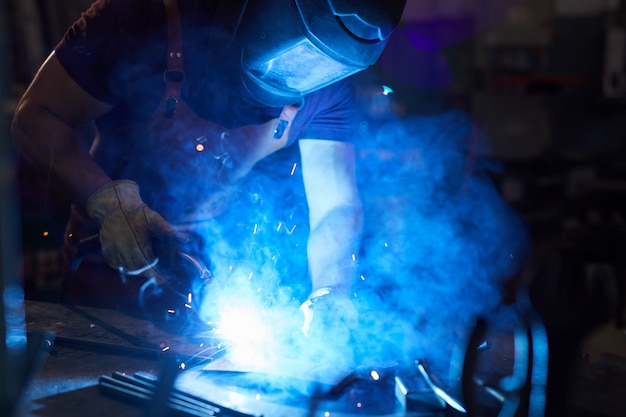 Mechanic using welding torch