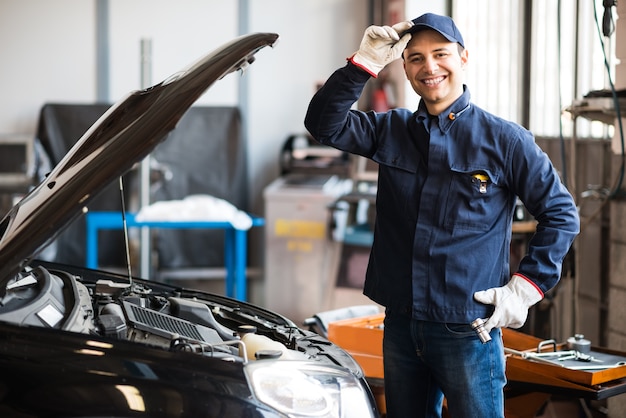 Mechanic working on a car engine