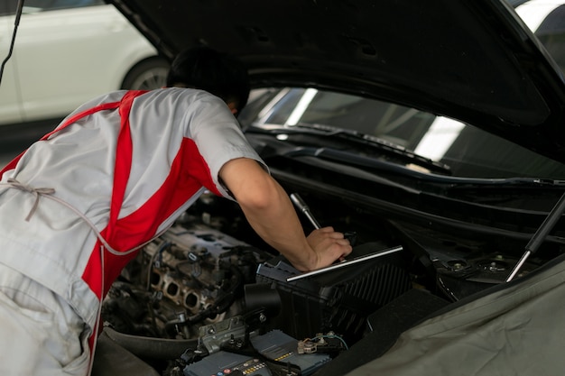 Mechanic working car maintenance 