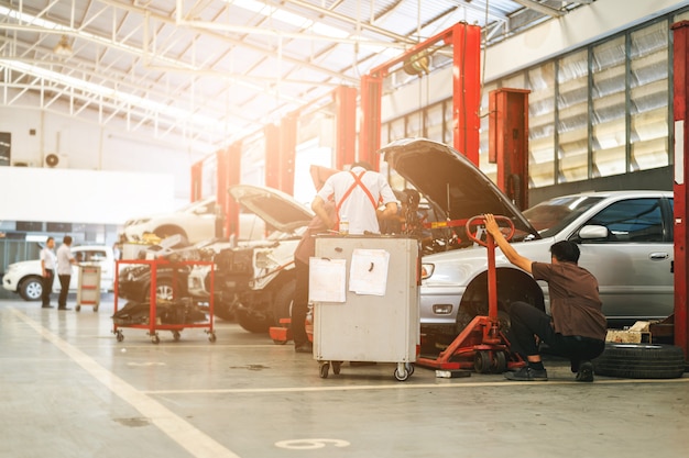 Mechanic working car maintenance 