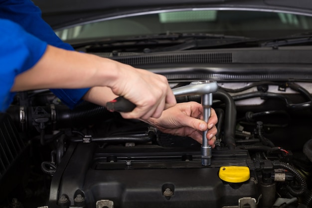 Mechanic working under the hood 