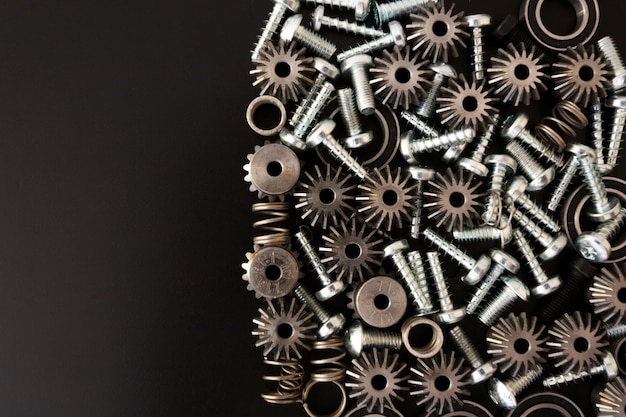 Mechanical components on black background. Industrial objects