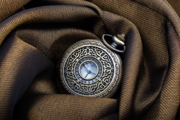 Mechanical pocket watch on afabric